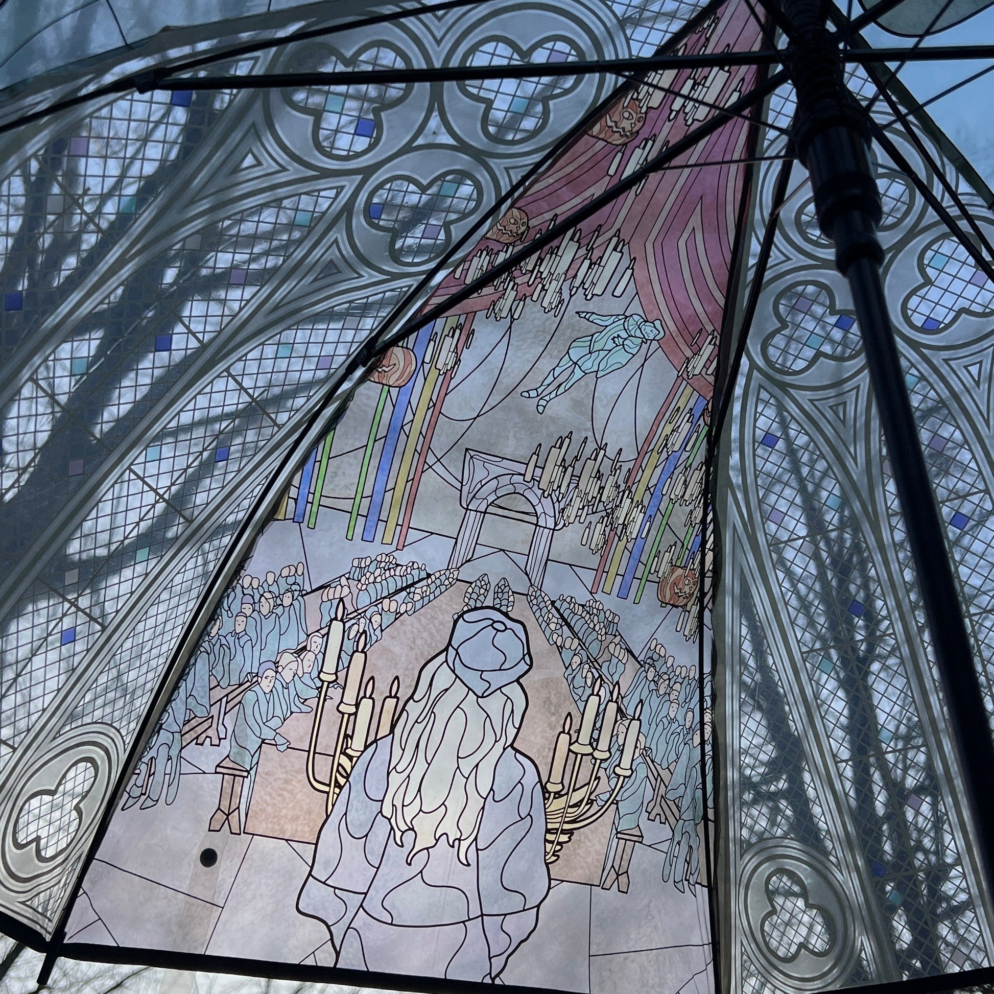 Wizard-inspired stained glass canopy umbrella featuring illustrated panels of a magical castle, whimsical crooked house, enchanted willow tree, grand candlelit dining hall, and vintage steam train.