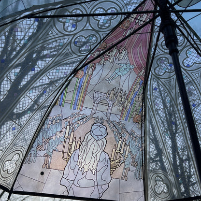 Wizard-inspired stained glass canopy umbrella featuring illustrated panels of a magical castle, whimsical crooked house, enchanted willow tree, grand candlelit dining hall, and vintage steam train.