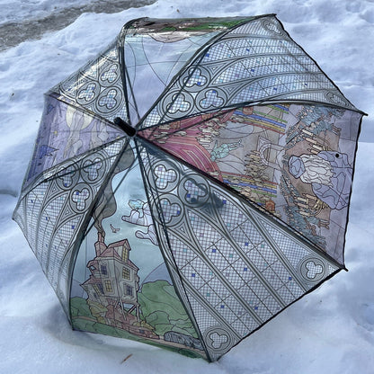 Wizard-inspired stained glass canopy umbrella featuring illustrated panels of a magical castle, whimsical crooked house, enchanted willow tree, grand candlelit dining hall, and vintage steam train.