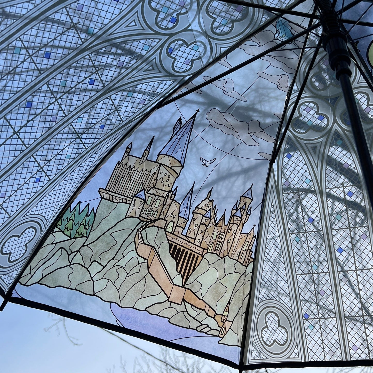 Decorative umbrella with stained glass-style castle design